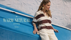  Woman in a striped shirt leaning against a blue boat with text overlay.