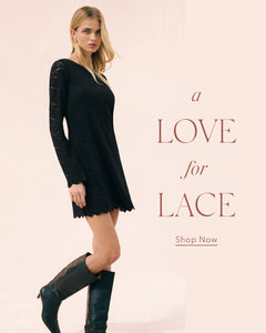  Woman wearing a black dress with lace details on a beige background, with text 'a LOVE for LACE' and 'Shop Now'.