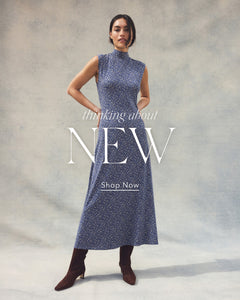  Woman wearing a blue dress with text 'thinking about NEW Shop Now' on a gray background