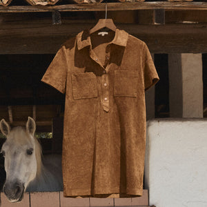  Brown shirt on a hanger with a horse in the background