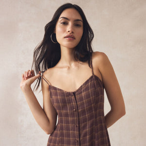 DressesMelbourne Sandy Bay Palm Midi Dress Woman wearing a plaid dress against a plain background