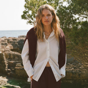 SweatersLooking Glass Crochet Polo Sweater Woman standing outdoors with a scenic background