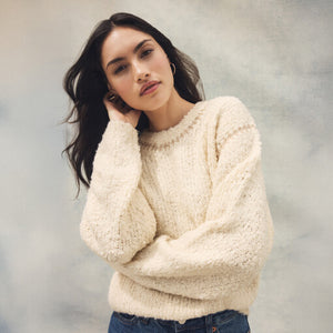 TopsSirena Rib Tank Woman wearing a cream sweater against a neutral background